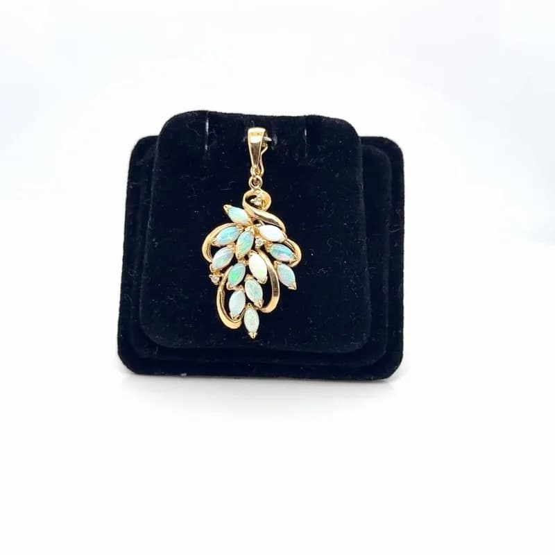 Yellow-gold opal and diamond pendant photographed by SDJB