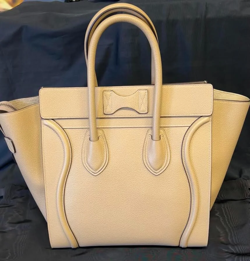 Close-up of a Celine Luggage Phantom tote in taupe leather, front on, showing the winged sides and zip face, bought and authenticated by San Diego Jewelry Buyers